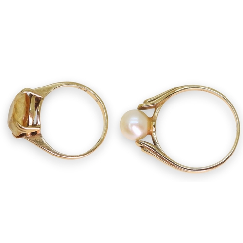 752 - A 9ct gold citrine set ring, size J, and a 9ct gold pearl set ring, size P1/2, weight combined 5.2gm... 