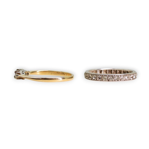 753 - An 18ct gold diamond and red gem set ring, size O, weight 2.1gms, together with a white metal clear ... 