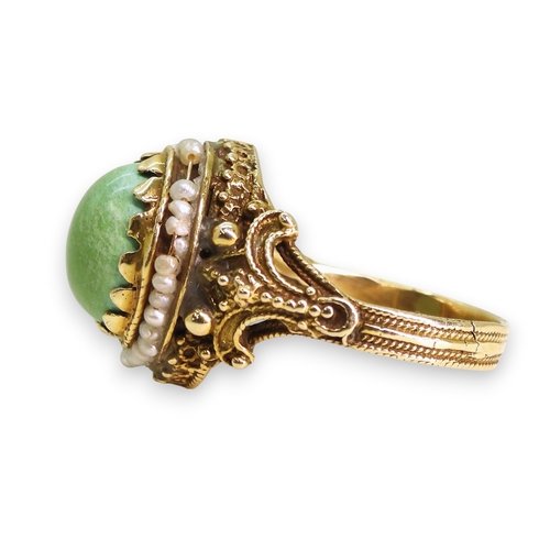 755 - A yellow metal ring set with seed pearls and turquoise, indistinctly stamped 14, size L1/2, weight 4... 
