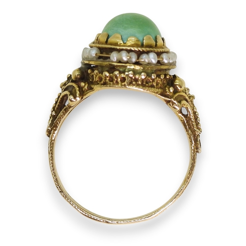 755 - A yellow metal ring set with seed pearls and turquoise, indistinctly stamped 14, size L1/2, weight 4... 
