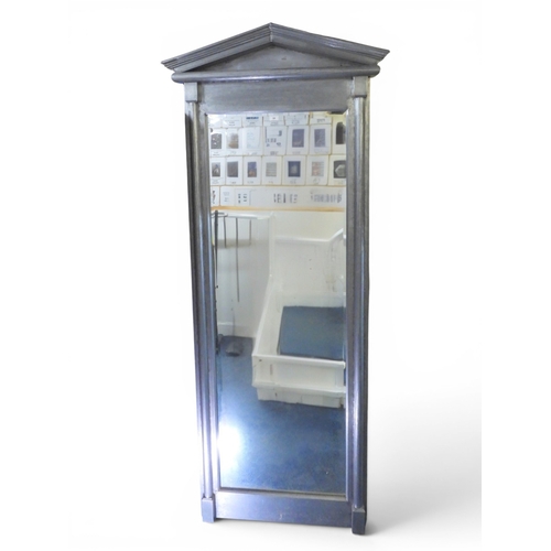 24 - A large contemporary metallic framed mirror with architectural surmount over rectangular bevelled gl... 