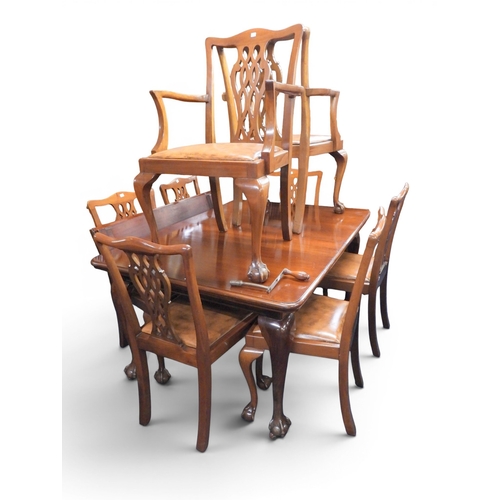 48 - A large early 20th century mahogany wind out extending dining table and eight chairs (two carvers an... 