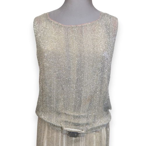 8003 - A 1920s flapper dress with scoop neckline, beaded drop waist silhouette and beaded fringe skirt, the... 