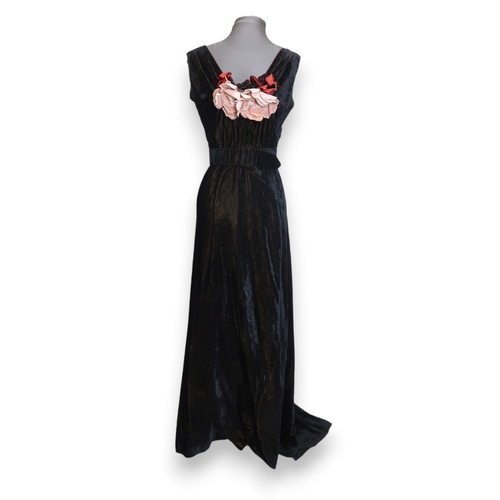 8007 - A 1930s black nacré velvet evening gown with applied velvet flower corsage by Reville London; togeth... 