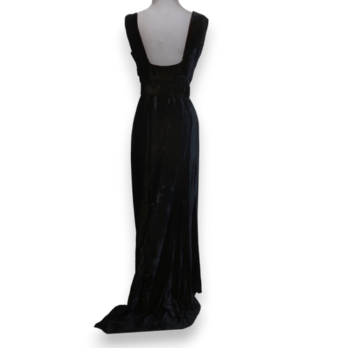 8007 - A 1930s black nacré velvet evening gown with applied velvet flower corsage by Reville London; togeth... 