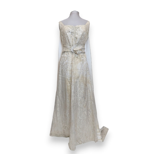 8004 - A 1950s/60s champagne damask evening gown with detachable cape train and matching belt with rhinesto... 