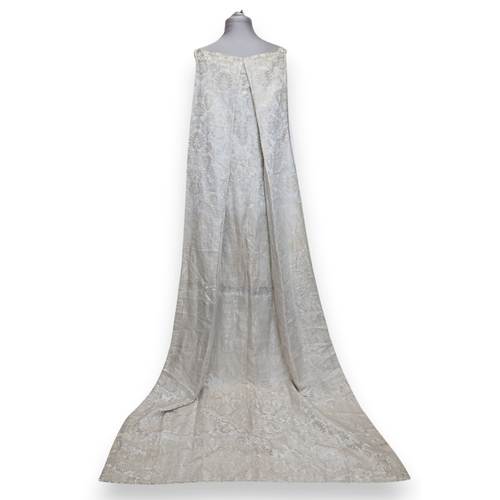 8004 - A 1950s/60s champagne damask evening gown with detachable cape train and matching belt with rhinesto... 