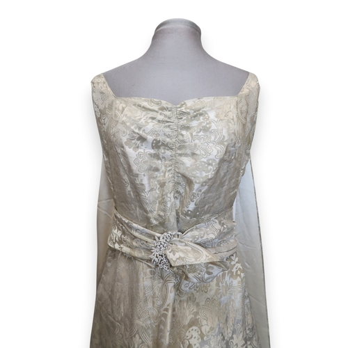 8004 - A 1950s/60s champagne damask evening gown with detachable cape train and matching belt with rhinesto... 