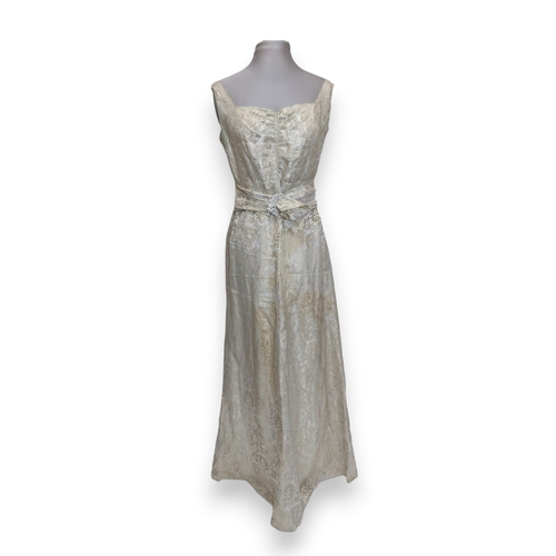 8004 - A 1950s/60s champagne damask evening gown with detachable cape train and matching belt with rhinesto... 