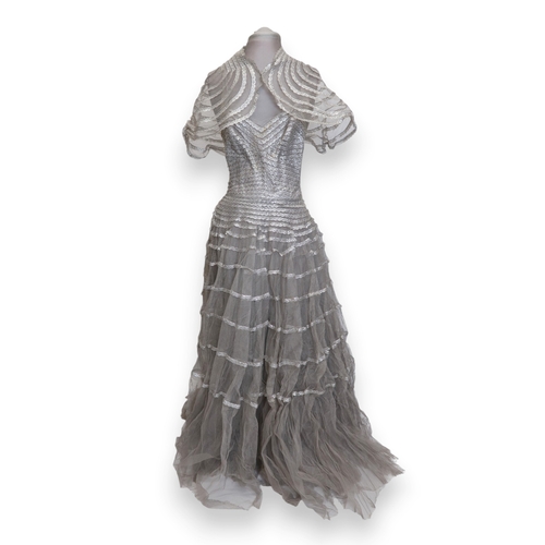 8004 - A 1950s/60s champagne damask evening gown with detachable cape train and matching belt with rhinesto... 