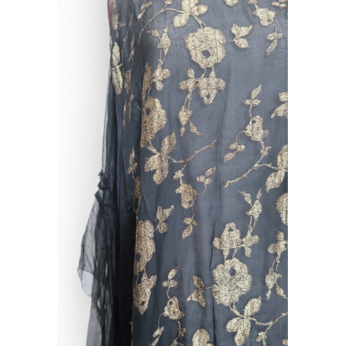 8006 - A 1920s black chiffon evening dress woven with metallic threads in floral design, with chiffon hangi... 
