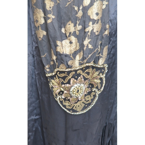 8006 - A 1920s black chiffon evening dress woven with metallic threads in floral design, with chiffon hangi... 