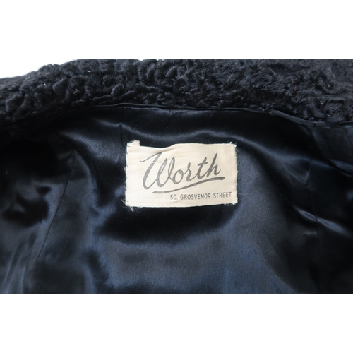 8008 - An Astrakhan Persian lamb double breasted jacket by Worth London, a crocodile handbag and a black co... 