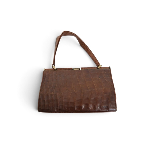 8008 - An Astrakhan Persian lamb double breasted jacket by Worth London, a crocodile handbag and a black co... 