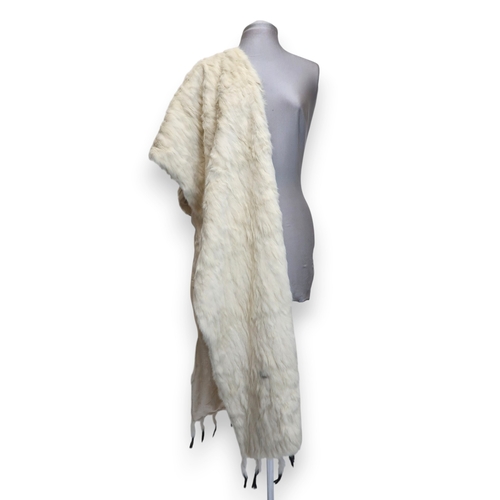 8010 - A circa 1920s cream devore shawl with passementerie fringing and an ermine fur shawl lined with chin... 
