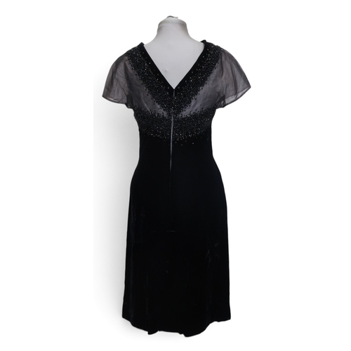 8015 - Three 1950s couture Norman Hartnell dresses comprising a black velvet cocktail dress with beaded swe... 
