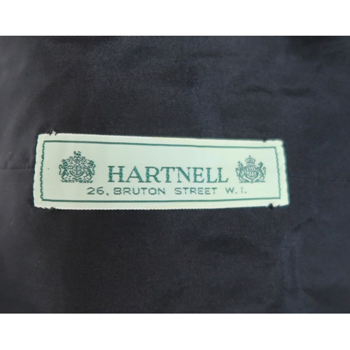 8015 - Three 1950s couture Norman Hartnell dresses comprising a black velvet cocktail dress with beaded swe... 