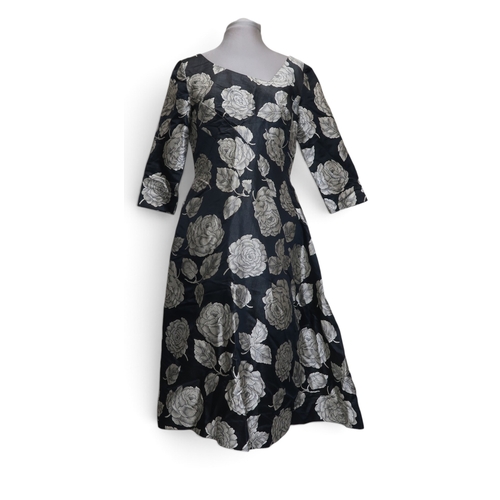 8015 - Three 1950s couture Norman Hartnell dresses comprising a black velvet cocktail dress with beaded swe... 