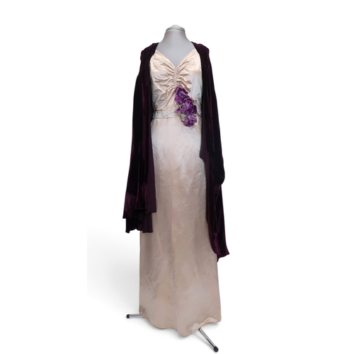 8019 - A 1930s pink silk satin evening dress with applied velvet flower corsage to the waist and a purple v... 