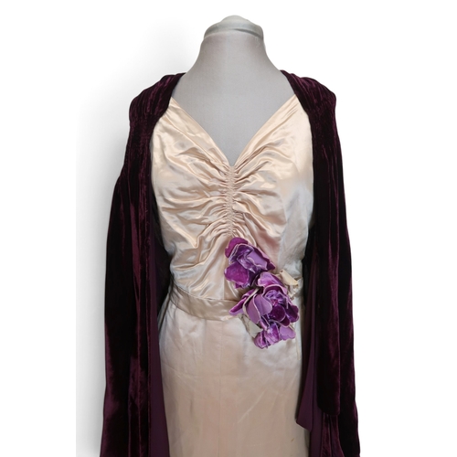 8019 - A 1930s pink silk satin evening dress with applied velvet flower corsage to the waist and a purple v... 