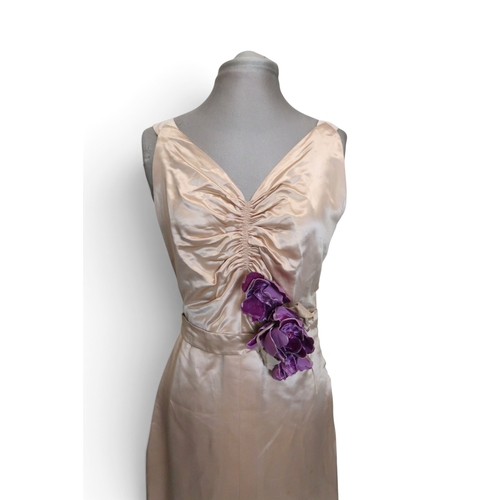 8019 - A 1930s pink silk satin evening dress with applied velvet flower corsage to the waist and a purple v... 