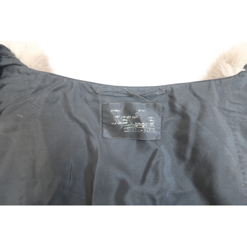 8020 - *Amended* A 1920s fur trimmed black cape by Reville London, a black shawl with silver lamé leaf-patt... 