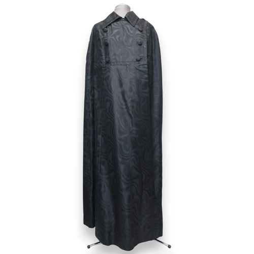 8012 - 1950's and 60's ladieswear comprising a black moiré full-length double breasted cape, a coordinated ... 