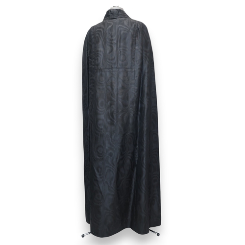 8012 - 1950's and 60's ladieswear comprising a black moiré full-length double breasted cape, a coordinated ... 