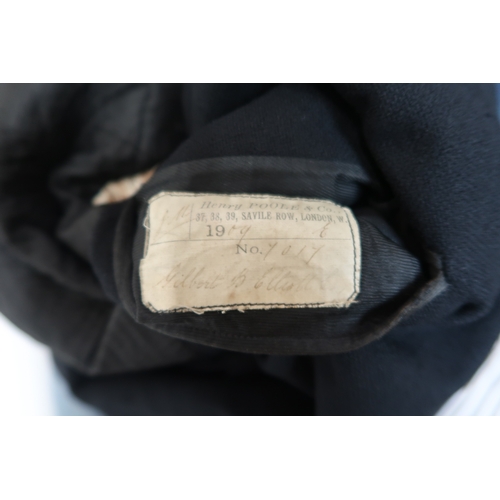 8021 - A black tailcoat by Henry Poole & Co. Saville Row and a Rodex Skye Tweed coat (2)black tailcoat:... 