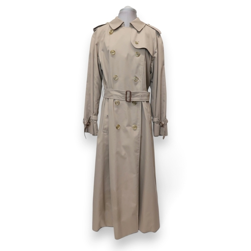 8030 - A vintage Burberry trench coat with belt, lined in nova check pattern