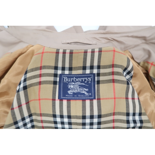 8030 - A vintage Burberry trench coat with belt, lined in nova check pattern