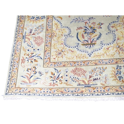 2081 - A LIGHT GREEN GROUND FINE PILE TABRIZ RUGwith beige sunburst central medallion and lighter spandrels... 