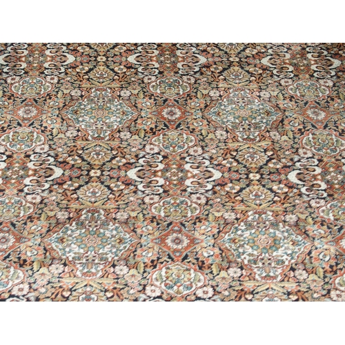 2082 - A LARGE MULTICOLOURED GROUND BIDJAR RUGwith extensively decorated floral/foliate patterned ground wi... 