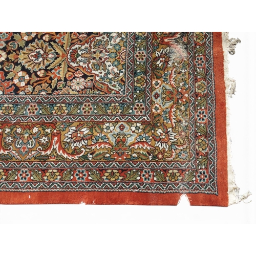 2082 - A LARGE MULTICOLOURED GROUND BIDJAR RUGwith extensively decorated floral/foliate patterned ground wi... 