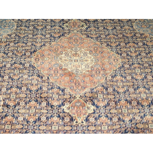 2083 - A DARK BLUE GROUND FINE PILE MAHAL RUGwith pink and cream diamond form central medallion and light b... 