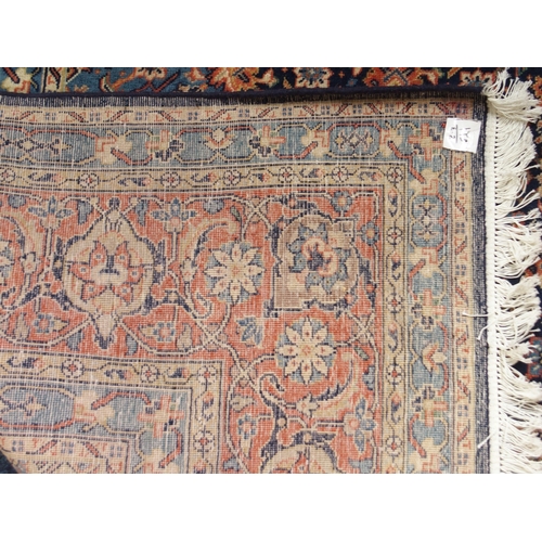 2083 - A DARK BLUE GROUND FINE PILE MAHAL RUGwith pink and cream diamond form central medallion and light b... 