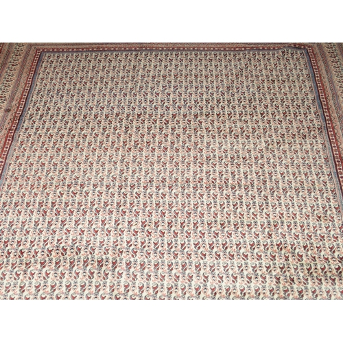 2086 - A LARGE CREAM GROUND DEEP PILE MAHAL RUGwith all-over multicoloured geometric patterned ground withi... 