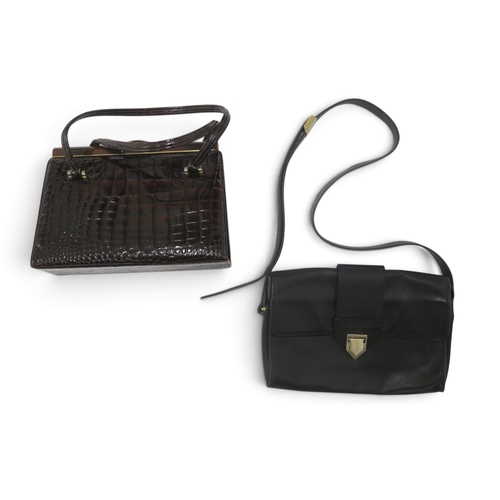 8044 - A vintage Yves Saint Laurent black grained leather handbag with flap closure and a dark brown crocod... 