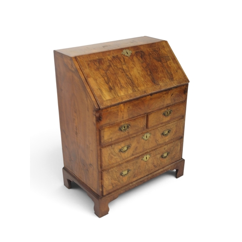 2003 - A GEORGIAN BURR WALNUT VENEERED FALL FRONT WRITING BUREAUwith fall front writing compartment extensi... 