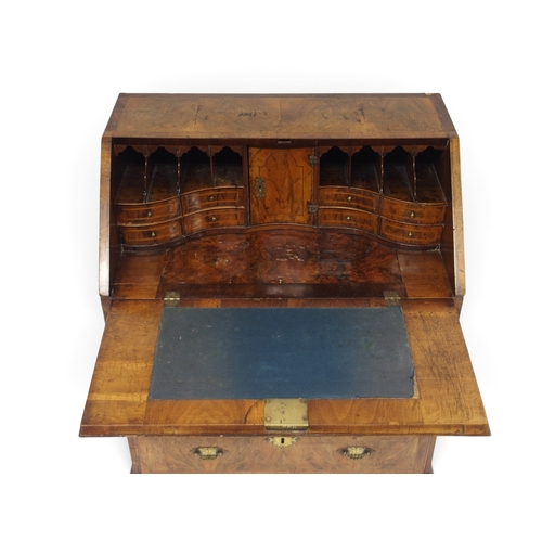 2003 - A GEORGIAN BURR WALNUT VENEERED FALL FRONT WRITING BUREAUwith fall front writing compartment extensi... 