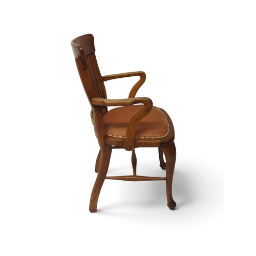 2005 - AN EARLY 20TH CENTURY OAK ARTS & CRAFTS STYLE COMB BACK DESK ARMCHAIR&nbsp;with shaped arms flan... 