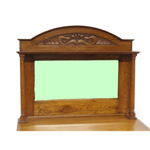 2006 - A LATE 19TH CENTURY OAK ARTS & CRAFTS MIRROR BACKED SIDEBOARDwith arched carved surmount over re... 