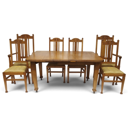 2007 - A LATE 19TH CENTURY OAK ARTS & CRAFTS DINING TABLE AND SIX CHAIRSextending dining table with sin... 