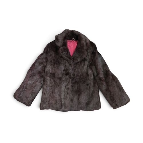 8034 - A French rabbit jacket in deep purple shade, a dark grey cape with arm slits, and a multi-tonal fur ... 