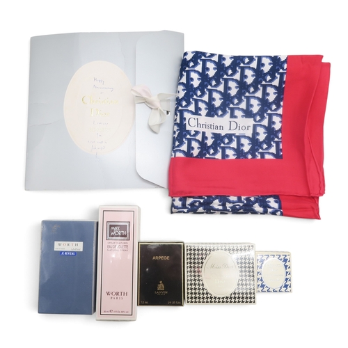 8051 - A Christian Dior silk scarf with blue monogram print on white ground with red border; together with ... 