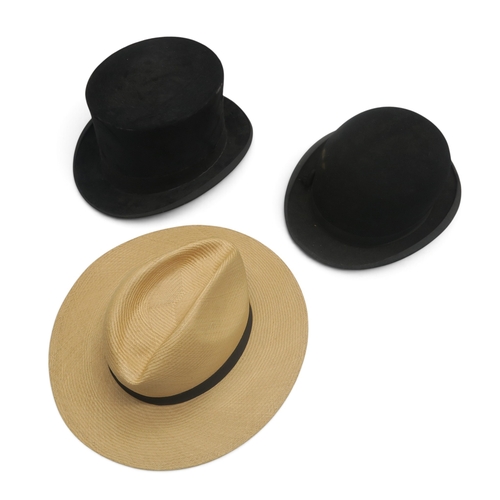8053 - A Russell Glasgow silk top hat of large proportions, measuring 20.5cm front-to-back internally and 1... 