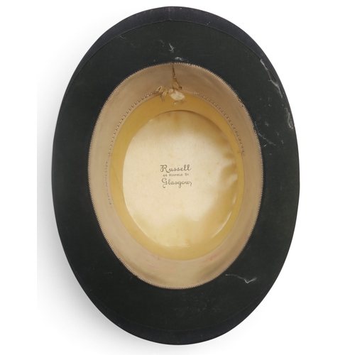 8053 - A Russell Glasgow silk top hat of large proportions, measuring 20.5cm front-to-back internally and 1... 