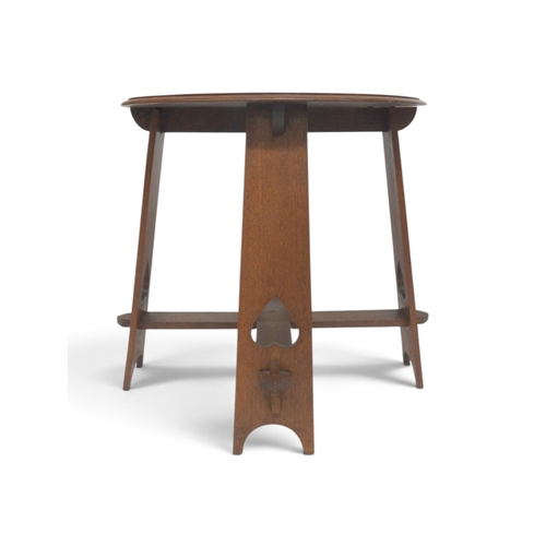 2010 - A LATE 19TH CENTURY OAK CIRCULAR TOPPED ARTS & CRAFTS OCCASIONAL TABLEwith tapering plank suppor... 
