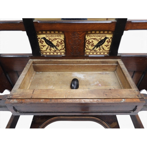 2017 - A LATE 19TH CENTURY OAK AND EBONISED ARTS & CRAFTS MIRROR BACKED HALLSTANDwith spindle mounted s... 