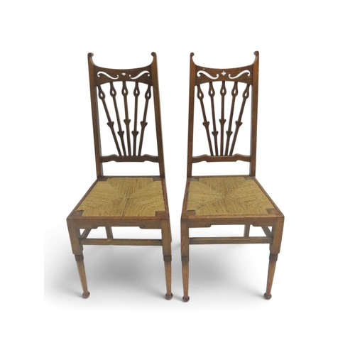 2032 - A PAIR OF 19TH CENTURY OAK FRAMED ARTS & CRAFTS BEDROOM CHAIRSwith pierced railed backs over str... 